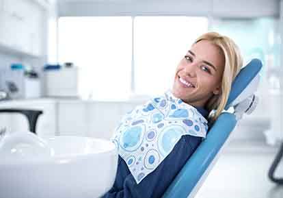 Smiling woman sitting in dental office