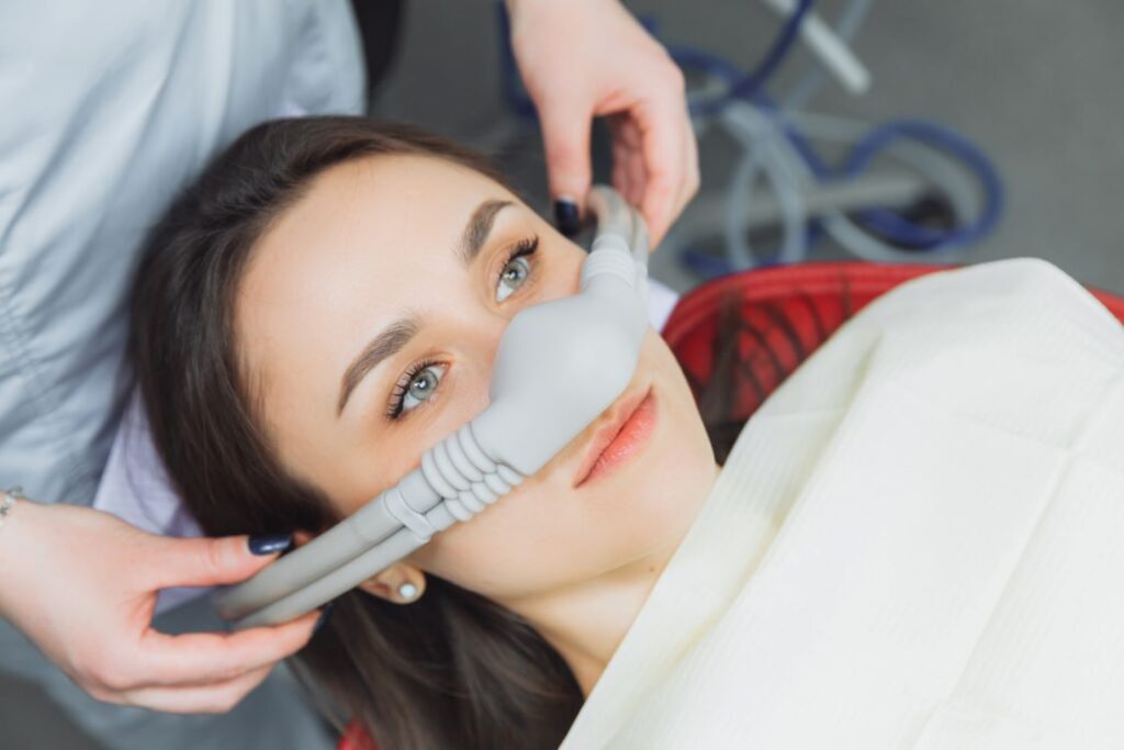 A woman getting nitrous oxide at the dentist.