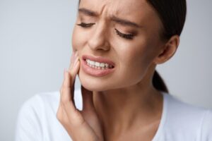 Woman with cheek pain