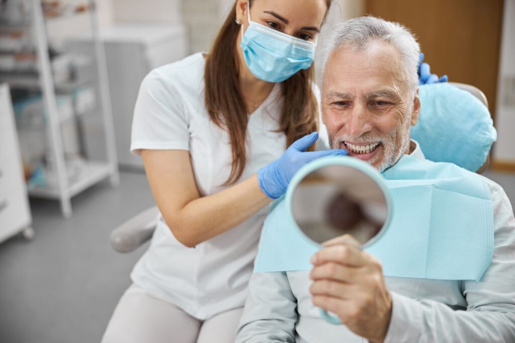 A man at the dentist getting dental implants.